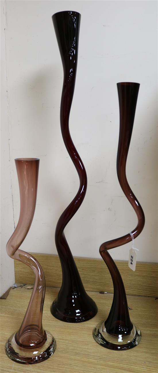 Three contemporary amethyst glass twist vases tallest 90cm